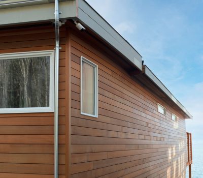 corner-of-a-wood-sided-beach-house-under-blue-sky-2025-01-08-11-38-52-utc